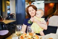 Woman with little girl in restaurant Royalty Free Stock Photo