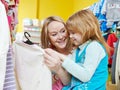 Woman and little girl shopping clothes Royalty Free Stock Photo