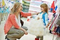Woman and little girl shopping clothes Royalty Free Stock Photo
