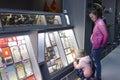 Woman and little girl standing in front of a stand with exhibits. Museum of aviation. Kyiv, Ukraine Royalty Free Stock Photo