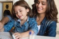 Woman and little girl using computer Royalty Free Stock Photo