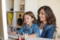 Woman and little girl using computer Royalty Free Stock Photo