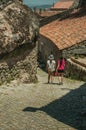 Woman and little girl walking down an alley at Monsanto Royalty Free Stock Photo