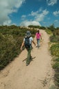 Woman and little girl walking in a trail on highlands Royalty Free Stock Photo