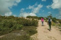 Woman and little girl walking in a trail on highlands Royalty Free Stock Photo