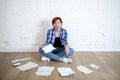 Woman at living room floor with calculator and bank and bills paperwork and documents doing domestic financial accounting Royalty Free Stock Photo