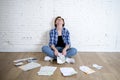 Woman at living room floor with calculator and bank and bills paperwork and documents doing domestic financial accounting Royalty Free Stock Photo