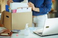 Woman in living room in sunny day organising home office