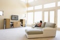 Woman in living room watching television