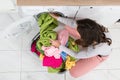 Woman Loading Clothes In Washer Royalty Free Stock Photo