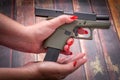 Woman Loading Handgun Magazine