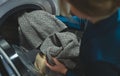 Woman loading laundry Royalty Free Stock Photo