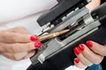 Woman loading rifle Royalty Free Stock Photo