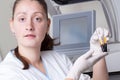 Woman loading samples in biochemical analyzer Royalty Free Stock Photo