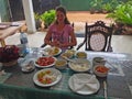 Woman and local cuisine and dishes of Sri Lanka Royalty Free Stock Photo