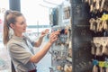 Woman locksmith choosing key blank