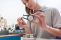 Woman locksmith repairing a lock