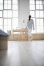 Woman In Loft Apartment