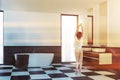 Woman in loft white gray bathroom corner Royalty Free Stock Photo