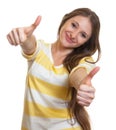 Woman with long brown hair showing both thumbs up Royalty Free Stock Photo