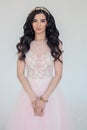 Woman with Long Curly Hair wearing Pink Dress Royalty Free Stock Photo