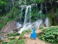 Woman in a long dress near waterfalls Soroa, Pinar del Rio, Cuba Royalty Free Stock Photo