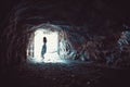 Woman in long dress standing in cave Royalty Free Stock Photo
