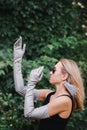 Woman in long gray gloves