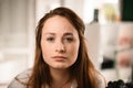 woman with long hair and blue eyes looking at the camera on blurred background Royalty Free Stock Photo