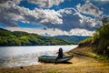 Woman with long hair on the boat by Vrutci lake on Zlatibor Royalty Free Stock Photo