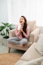 Woman with long hair holding blow dryer Royalty Free Stock Photo