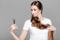 Woman with long hair holds scissors Royalty Free Stock Photo