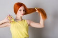 Woman with long hair holds scissors Royalty Free Stock Photo