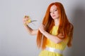 Woman with long hair holds scissors Royalty Free Stock Photo