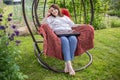 Woman with long hair resting after work at a laptop Royalty Free Stock Photo