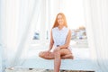 Beautiful woman with long hair walks on the beach by the sea Royalty Free Stock Photo