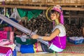 Kayan girl with loom