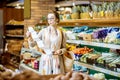 Woman with long shopping list in the supermarket Royalty Free Stock Photo