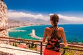 Woman look on landscape of Alanya with marina and Kizil Kule red tower in Antalya district, Turkey, Asia. Famous tourist