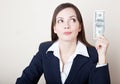 Woman is looking at 100 dollars banknote Royalty Free Stock Photo