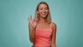 Woman looking approvingly, showing ok approve feedback gesture like sign positive something good Royalty Free Stock Photo