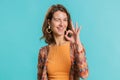 Woman looking approvingly, showing ok approve feedback gesture like sign positive something good Royalty Free Stock Photo