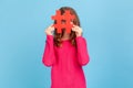 Woman looking through big red hashtag symbol, popular internet idea, viral content.