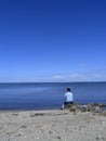 Woman looking at blue sea