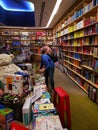 Woman looking books for children at bookstore Carturesti