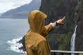 Woman looking at Bridal Veil Falls veu da noiva in Madeira, Portugal