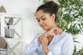 Woman looking at camera lying on front arms crossed