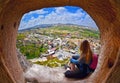 Woman looking into the distance against the background of incredible landscape