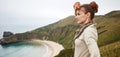 Woman looking into distance in front of ocean view landscape Royalty Free Stock Photo