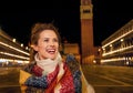 Woman looking into distance standing near St Marks Campanile Royalty Free Stock Photo